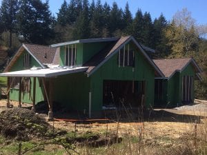 Roofing is mostly on. We put plastic over the windows to keep out any wind blown rain until the windows show up