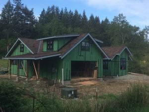 Metal roofing was used on the shallow slope roofs. And the windows are in now too!
